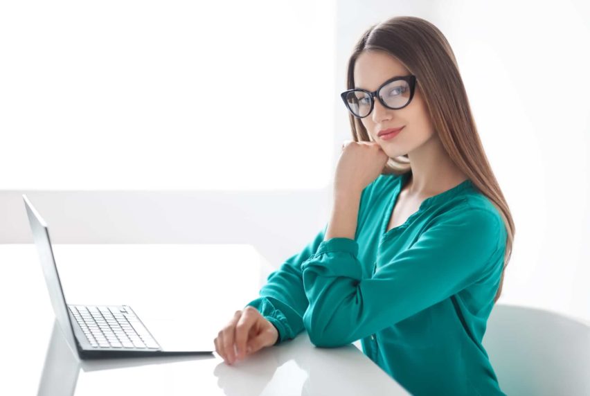 Confident business woman with laptop in the office. Business concept